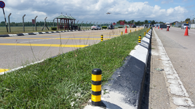 Median post installed on road